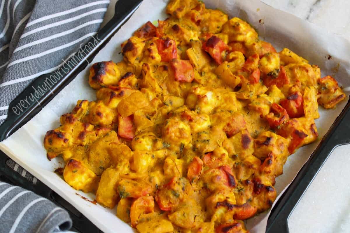 baked paneer with veggies in a tray