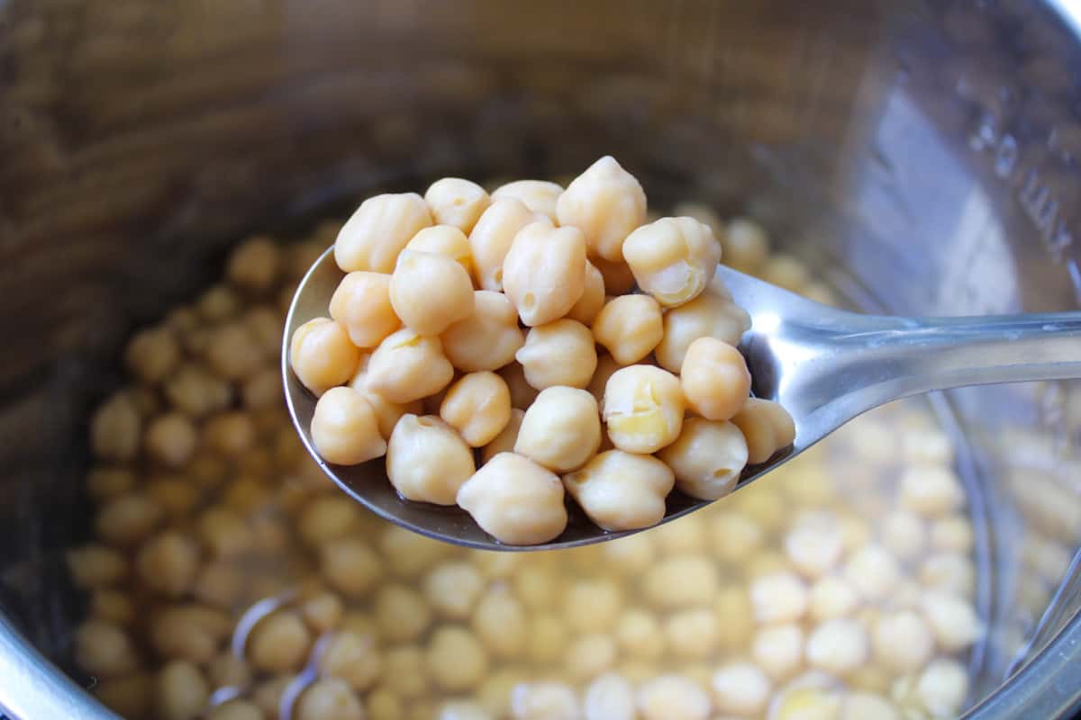 cooked chickpeas in a spoon