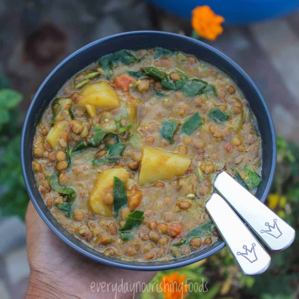 potato lentil kale soup in a bowl