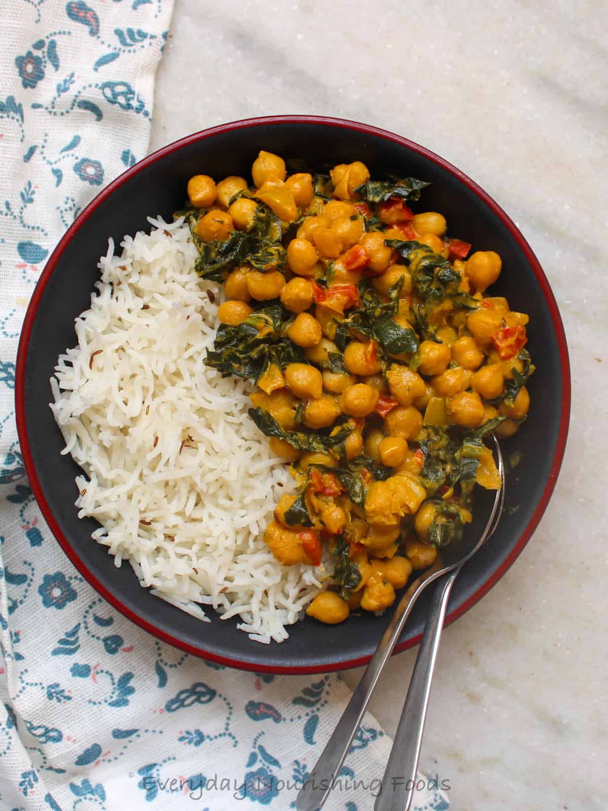 chickpea kale curry with rice in a bowl