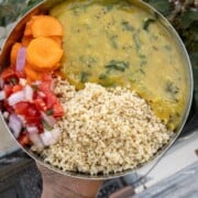 cooked millet with red lentil dal and veggie salad