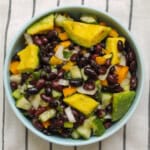 Black bean avocado salad served in a blue bowl.