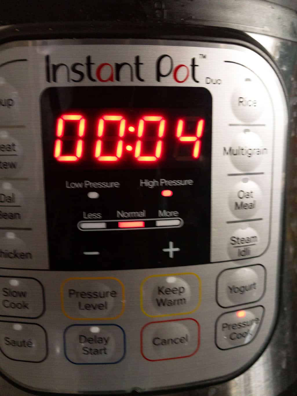 Instant Pot display showing 4 minutes set on Pressure Cook mode.