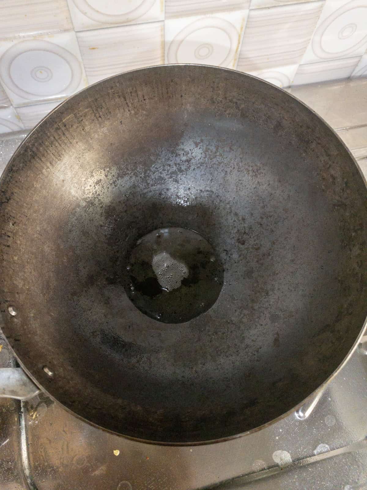 Oil heating in a kadai for making tadka.