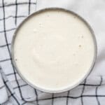 Finished smooth cashew cream in a steel bowl.