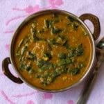 Close-up of creamy kale dal showing soft lentils and tender kale pieces.