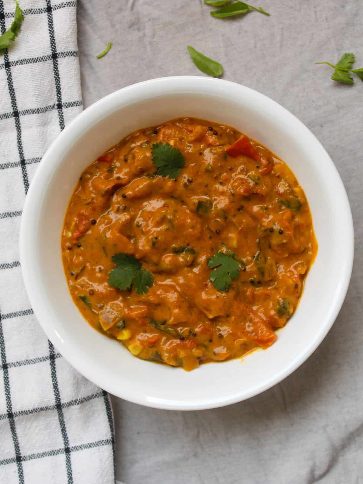 Rustic-textured South Indian tomato curry made in 15 minutes and served warm for lunch or dinner.