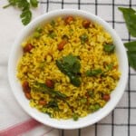 Leftover basmati rice tempered South Indian style with peanuts, green peas, curry leaves, and green chili.