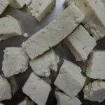 Homemade paneer cubes cut and ready to use in recipes.