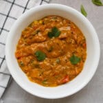 Close-up of 15-minute South Indian tomato curry without coconut or cream, garnished with fresh cilantro.
