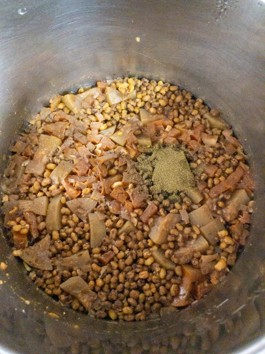 Cooked whole moong dal in the Instant Pot with kasuri methi powder and fresh cilantro added on top.