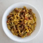 Indian cabbage stir fry with kidney beans served in a white bowl.